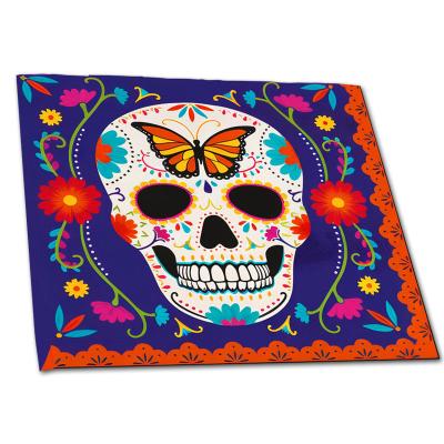 Papier-Servietten mit buntem Schädel Motiv für den mexikanischen Dia de los Muertos (Tag der Toten).