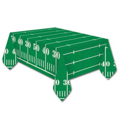 Grün-weißes Papier Tischtuch im Design eines American Football Spielfeldes.